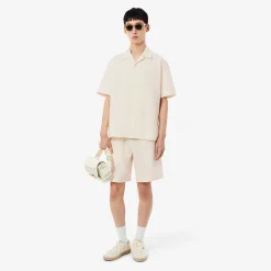Lacoste miesten lyhythihainen kauluspaita Relaxed Fit Waffle Texture Shirt, valkoinen